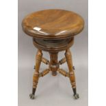 A late 19th/early 20th century American piano stool.