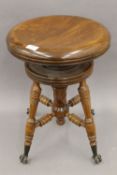 A late 19th/early 20th century American piano stool.