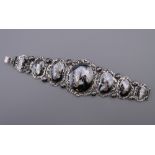 A Siam sterling silver and niello bracelet finely worked in seven hinged sections. 17.5 cm long.