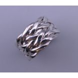 A silver plait/knot ring. Ring size Q.