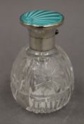 A cut glass silver and turquoise enamel topped scent bottle, hallmarked for Birmingham 1937.