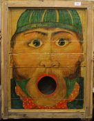 A Folk Art painted fairground ball game panel, framed. 56.5 x 73 cm overall.