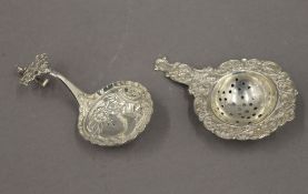 An 800 silver tea strainer and a Continental silver spoon. The former 11 cm long. 65.2 grammes.