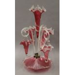 A Victorian cranberry glass epergne, with one branch lacking. 56.5 cm high.