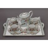 A porcelain duet tea set on tray. 39 cm wide.