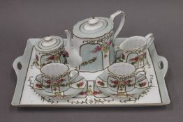 A porcelain duet tea set on tray. 39 cm wide.