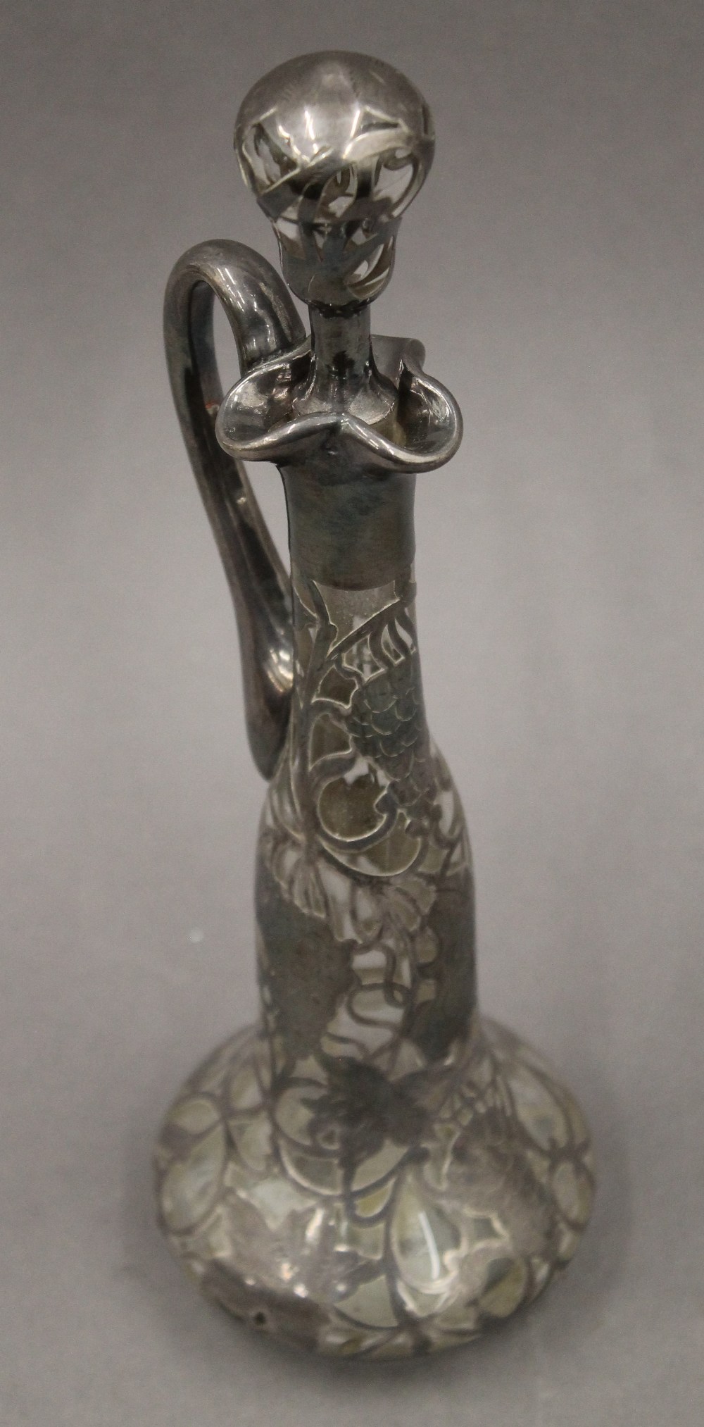 An unmarked silver overlay claret jug. 28.5 cm high.