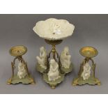 A Victorian Parian mounted centrepiece with a pair of matching candle lamps. The former 31.