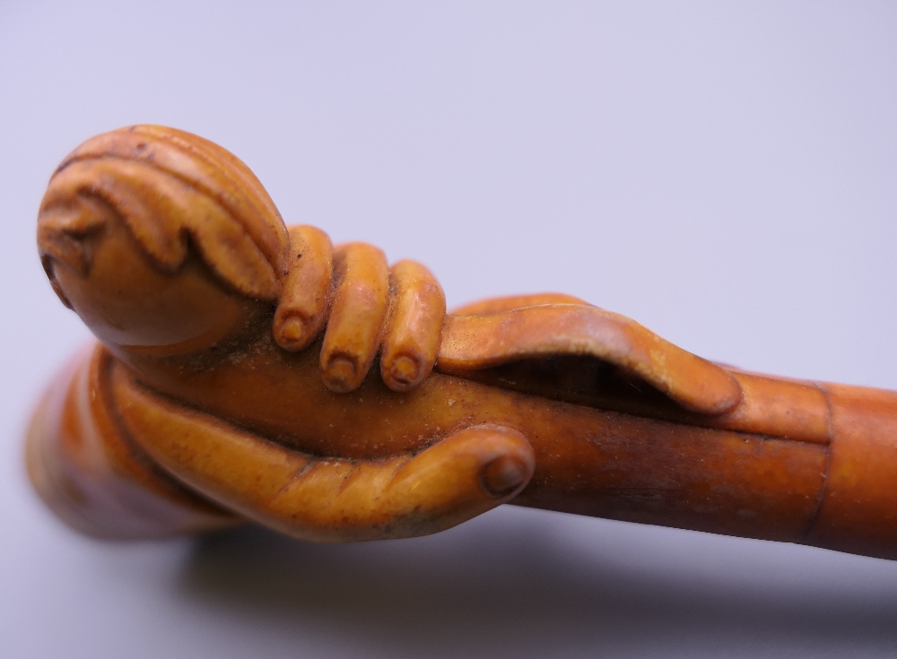 A cased 19th century meerschaum and amber pipe formed as a hand holding a pistol. 12 cm long. - Image 8 of 13