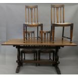 An oak refectory table and a set of four dining chairs. The table 167 cm long.