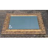 A modern decorative gilt framed mirror and another. The former 77 x 103 cm.