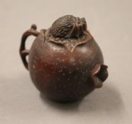 A Japanese carved wood fruit snuff bottle. 5 cm high.