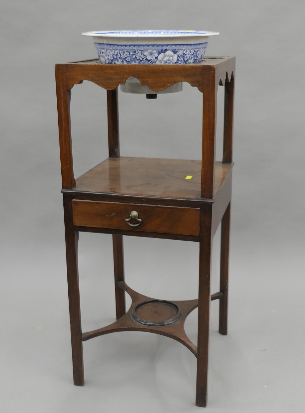A 19th century mahogany wash stand with associated bowl. 81 cm high.