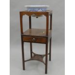 A 19th century mahogany wash stand with associated bowl. 81 cm high.