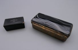 An agate set snuff box and a small papier mache snuff box. The former 6 cm long.