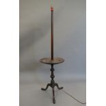 A mahogany standard lamp. 144 cm high.
