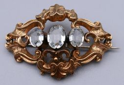 A Victorian unmarked gold paste set brooch. 5 cm wide. 7.2 grammes total weight.