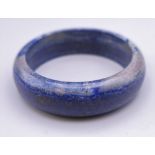 A lapis lazuli bangle. 7 cm external diameter.