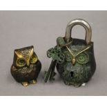 An owl formed padlock and a brass model of an owl. The latter 6.5 cm high.