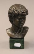 A bronze bust of a man. 16.5 cm high.