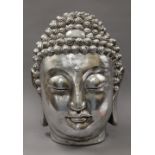 A silvered model Buddha head. 42 cm high.