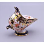 A Royal Crown Derby miniature porcelain coal scuttle. 6.5 cm high.