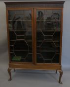 A 19th century glazed mahogany bookcase. 124 cm wide.