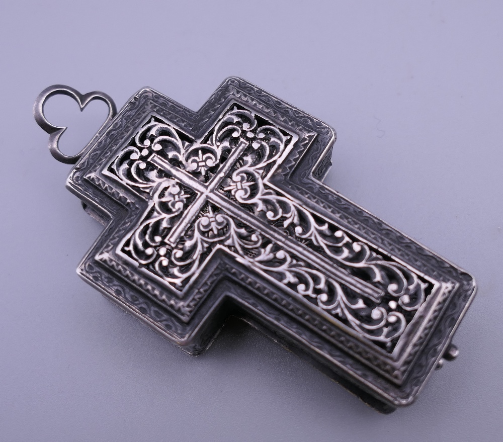 A 19th century unmarked white metal cross form pendant watch. 8 cm high. - Image 3 of 11