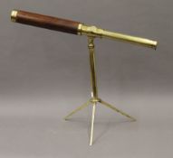 A Gilbert brass and mahogany library telescope with tripod, circa 1795 (in working order). 110.