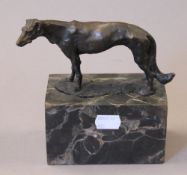 A bronze model of a greyhound. 15 cm long.