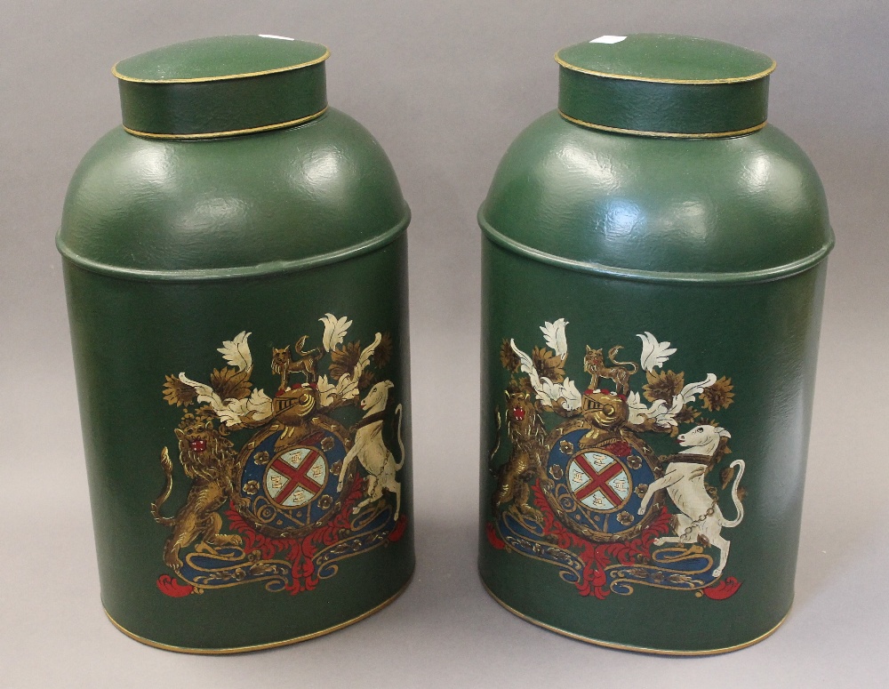 A pair of green toleware tea tins. 44 cm high.