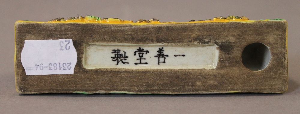 A Chinese yellow porcelain brush rest. 12.5 cm long. - Image 3 of 4