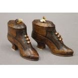 Two treen snuff shoes. Each 7 cm high.