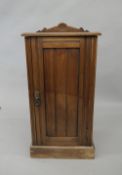 A Victorian walnut pot cupboard. 77 cm high.
