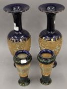 Two pairs of Royal Doulton stoneware vases. The largest 35 cm high.