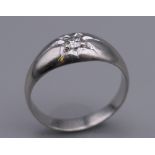 A platinum and diamond ring. Diamond approximately 0.20 carat. Ring size Q/R.