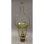 A Victorian brass and glass hanging oil lamp (converted to electricity). 80 cm high.