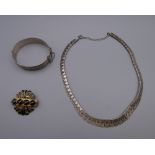 A silver necklace, a vintage silver bangle and a Victorian agate brooch.