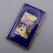 A vintage rolled gold and enamel cigarette case. 5 cm wide.