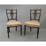 A pair of Victorian inlaid chairs. 45 cm wide.