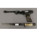 An Italian air pistol and an antler handled bayonet. The latter 38 cm long.