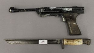 An Italian air pistol and an antler handled bayonet. The latter 38 cm long.