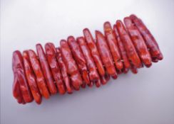 A coral bracelet. 19 cm long.