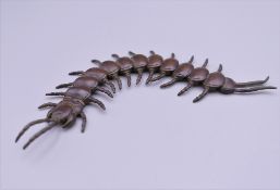 A bronze model of a centipede. 15 cm long.