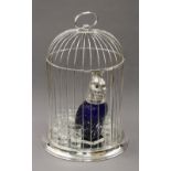 A silver plated birdcage decanter set. 45 cm high.