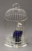 A silver plated birdcage decanter set. 45 cm high.