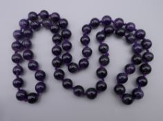 A string of amethyst beads. 70 cm long.