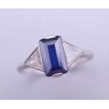 An Art Deco 585 platinum diamond and sapphire ring. Ring size L/M.