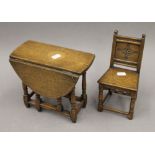 A miniature oak gate leg table and chair. The latter 22.5 cm high.