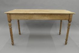 A Victorian pine table. 126.5 cm long, 57 cm wide, 67 cm high.
